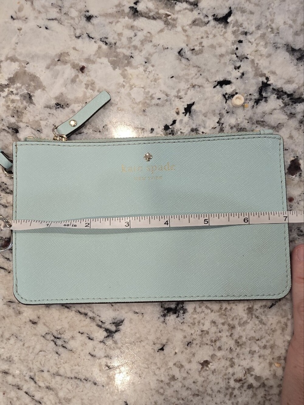 kate spade light mint phone wristlet with gold logo